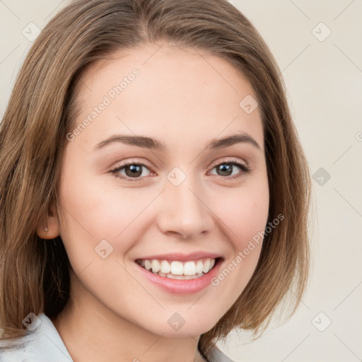 Joyful white young-adult female with medium  brown hair and green eyes