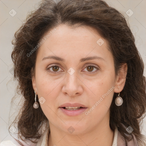 Joyful white adult female with long  brown hair and brown eyes