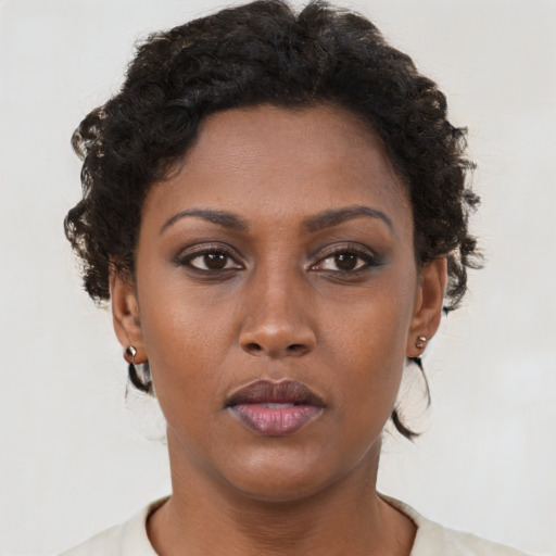 Neutral black young-adult female with short  brown hair and brown eyes