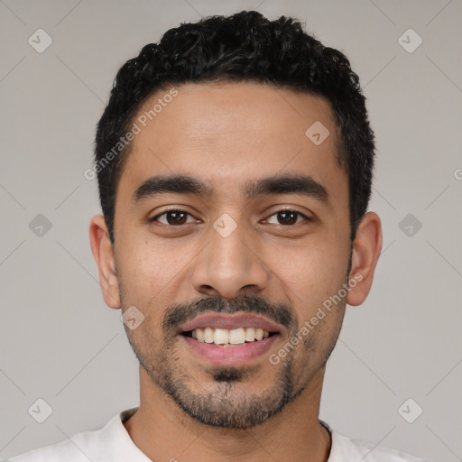 Joyful latino young-adult male with short  black hair and brown eyes