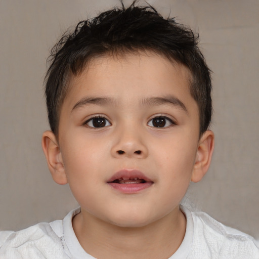 Joyful white child male with short  brown hair and brown eyes