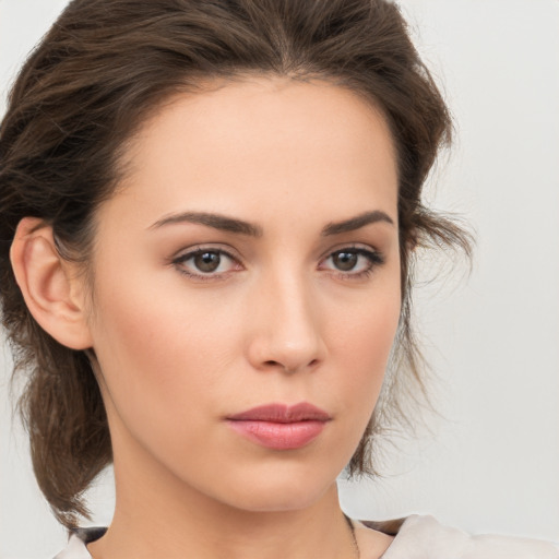 Neutral white young-adult female with medium  brown hair and brown eyes