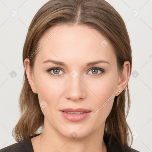 Joyful white young-adult female with long  brown hair and grey eyes