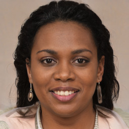 Joyful black young-adult female with medium  brown hair and brown eyes