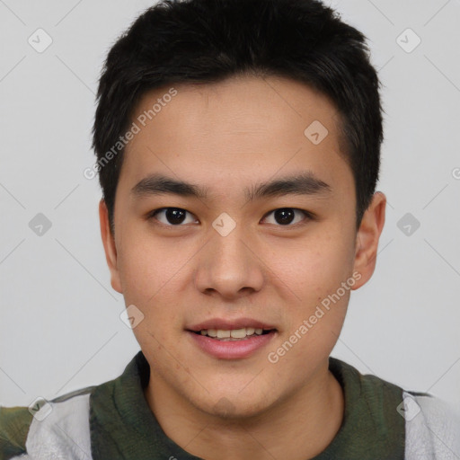 Joyful asian young-adult male with short  brown hair and brown eyes