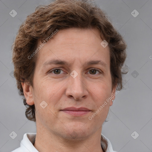 Joyful white adult male with short  brown hair and grey eyes