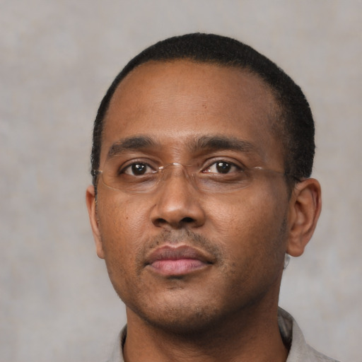 Neutral black young-adult male with short  black hair and brown eyes