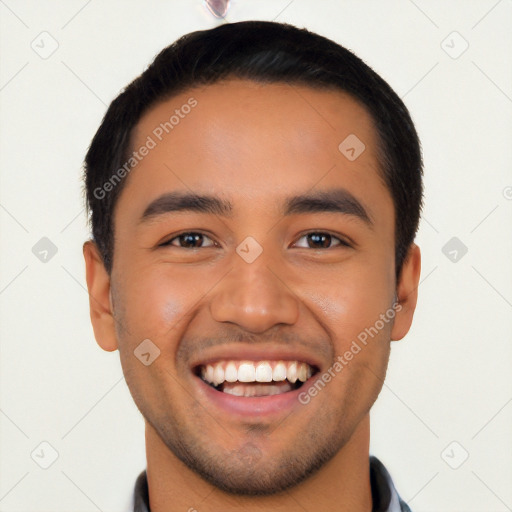 Joyful latino young-adult male with short  black hair and brown eyes