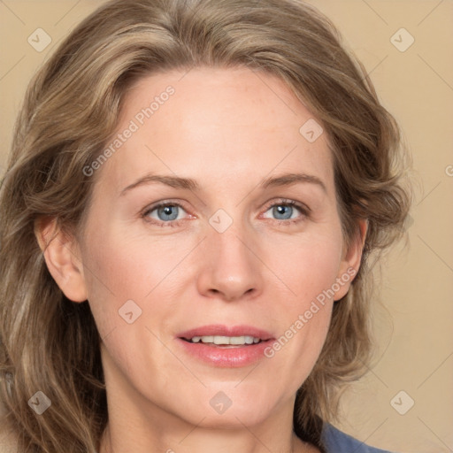 Joyful white adult female with medium  brown hair and blue eyes