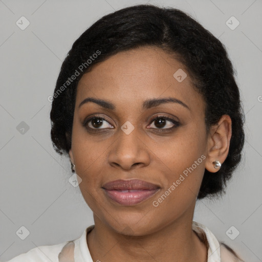 Joyful black young-adult female with medium  black hair and brown eyes