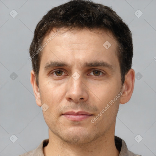 Joyful white young-adult male with short  brown hair and brown eyes