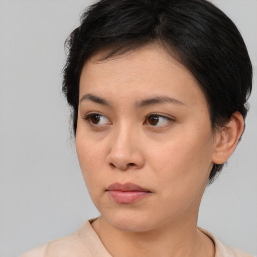 Neutral asian young-adult female with medium  brown hair and brown eyes