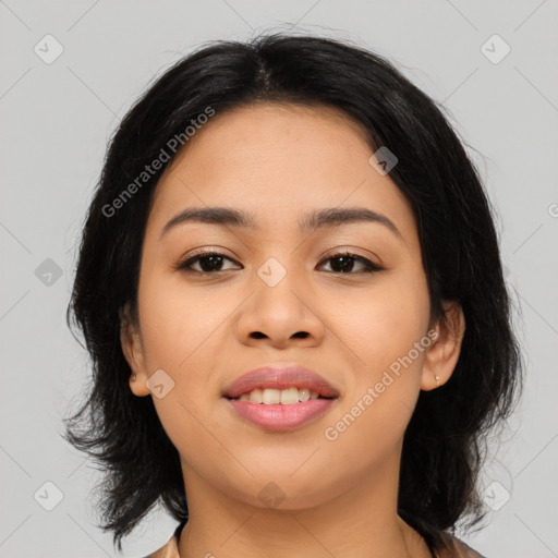 Joyful asian young-adult female with medium  black hair and brown eyes