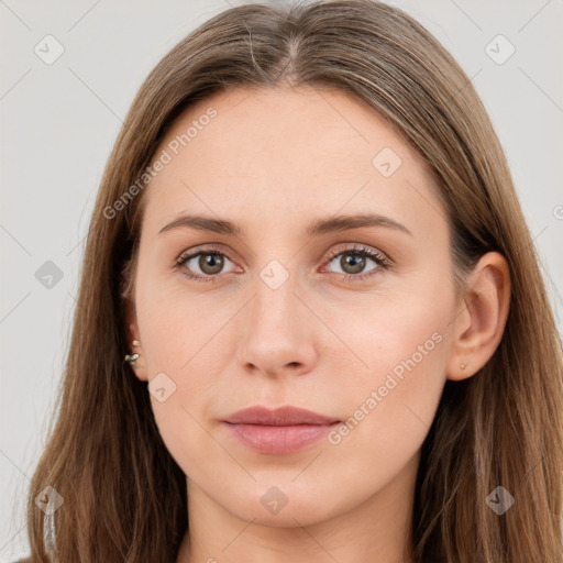 Neutral white young-adult female with long  brown hair and brown eyes