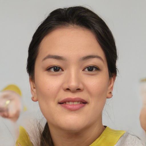 Joyful asian young-adult female with medium  brown hair and brown eyes