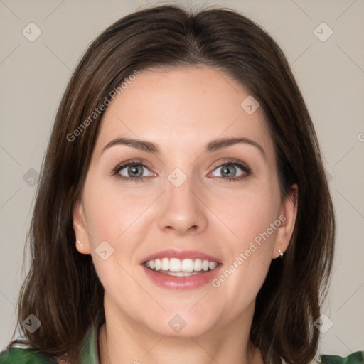 Joyful white young-adult female with medium  brown hair and green eyes