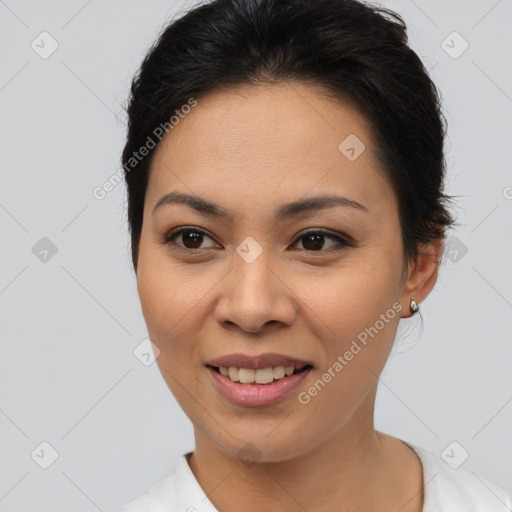 Joyful asian young-adult female with short  brown hair and brown eyes