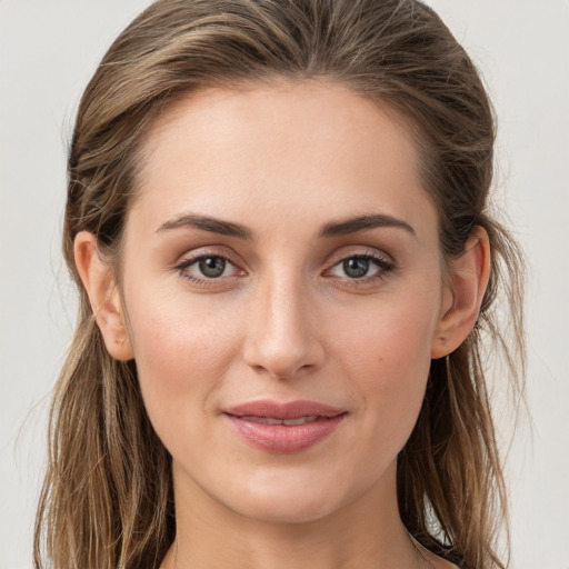 Joyful white young-adult female with long  brown hair and grey eyes