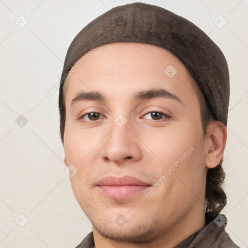 Joyful white young-adult male with short  black hair and brown eyes