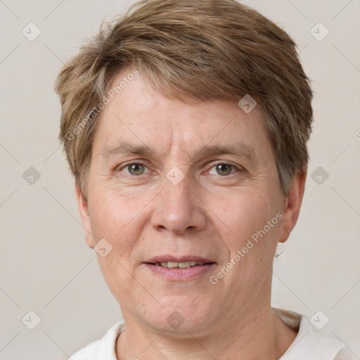 Joyful white adult male with short  brown hair and grey eyes