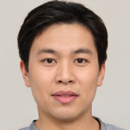 Neutral asian young-adult male with short  brown hair and brown eyes