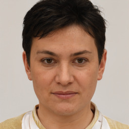 Joyful white adult female with short  brown hair and brown eyes