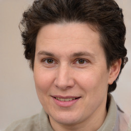 Joyful white adult female with short  brown hair and brown eyes