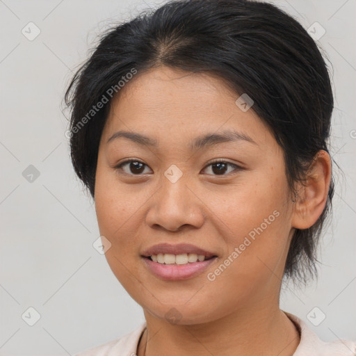 Joyful asian young-adult female with medium  brown hair and brown eyes