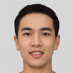 Joyful asian young-adult male with short  black hair and brown eyes