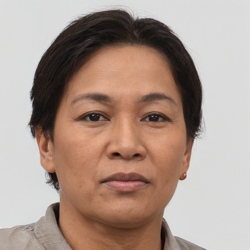 Joyful asian adult female with short  brown hair and brown eyes