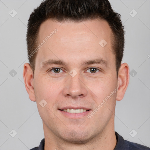 Joyful white young-adult male with short  brown hair and brown eyes