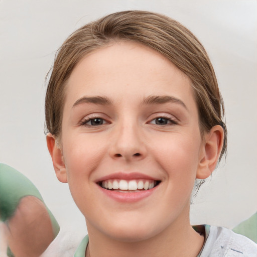 Joyful white young-adult female with medium  brown hair and blue eyes