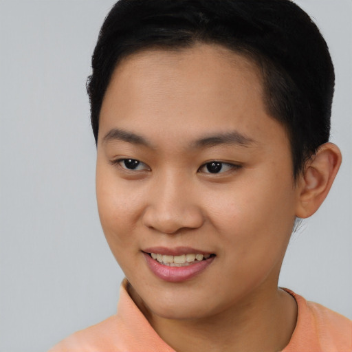 Joyful asian young-adult female with short  black hair and brown eyes