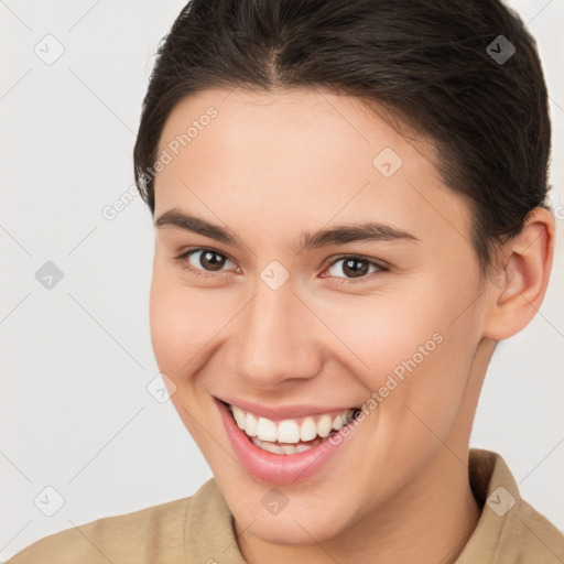 Joyful white young-adult female with short  brown hair and brown eyes