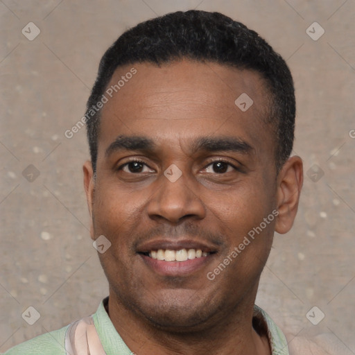 Joyful black young-adult male with short  black hair and brown eyes