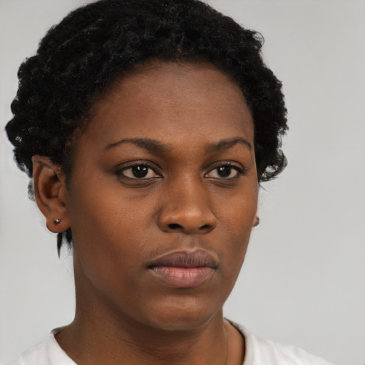 Neutral black young-adult female with short  black hair and brown eyes
