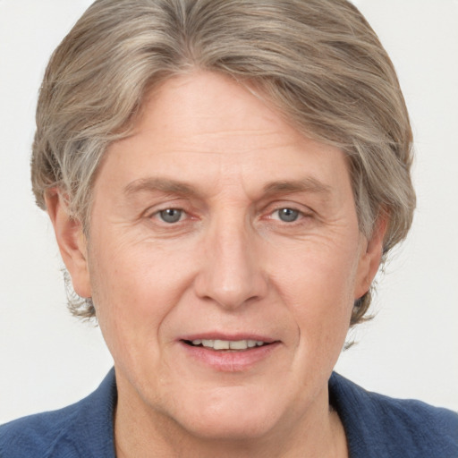 Joyful white adult female with medium  brown hair and grey eyes