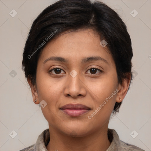 Joyful latino young-adult female with medium  brown hair and brown eyes