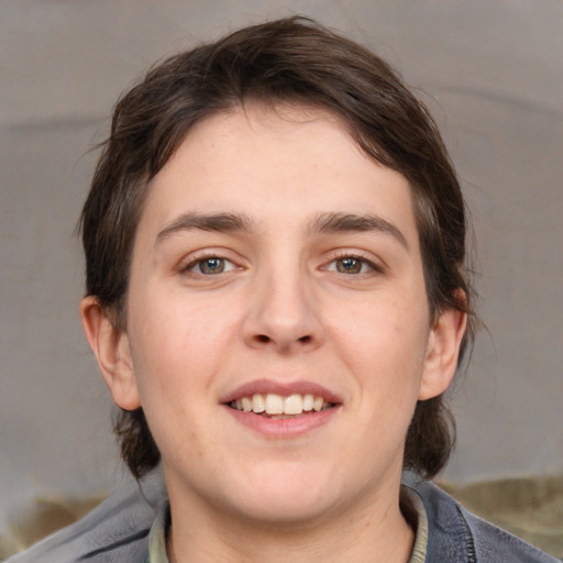 Joyful white young-adult male with medium  brown hair and brown eyes