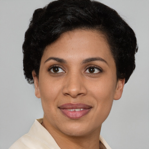 Joyful latino young-adult female with short  brown hair and brown eyes