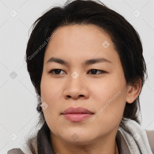 Joyful asian young-adult female with medium  black hair and brown eyes