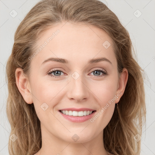 Joyful white young-adult female with long  brown hair and grey eyes