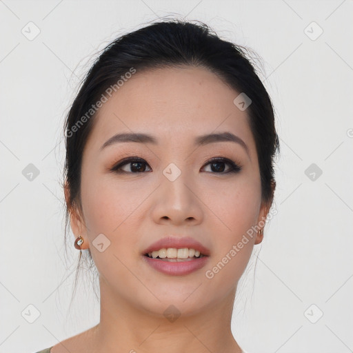 Joyful asian young-adult female with medium  black hair and brown eyes