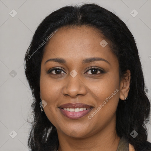 Joyful black young-adult female with long  black hair and brown eyes