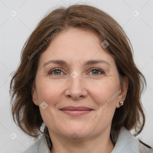 Joyful white adult female with medium  brown hair and grey eyes