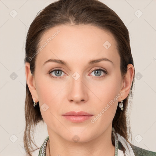 Joyful white young-adult female with medium  brown hair and blue eyes