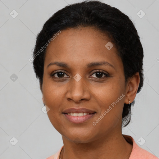 Joyful black adult female with short  brown hair and brown eyes