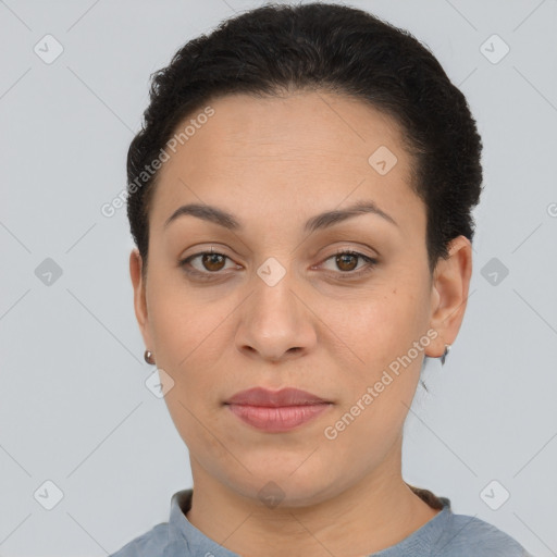 Joyful latino young-adult female with short  brown hair and brown eyes