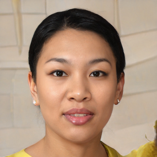 Joyful asian young-adult female with short  brown hair and brown eyes