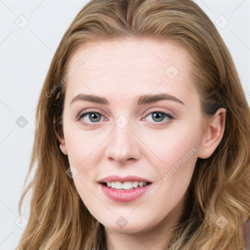 Joyful white young-adult female with long  brown hair and blue eyes